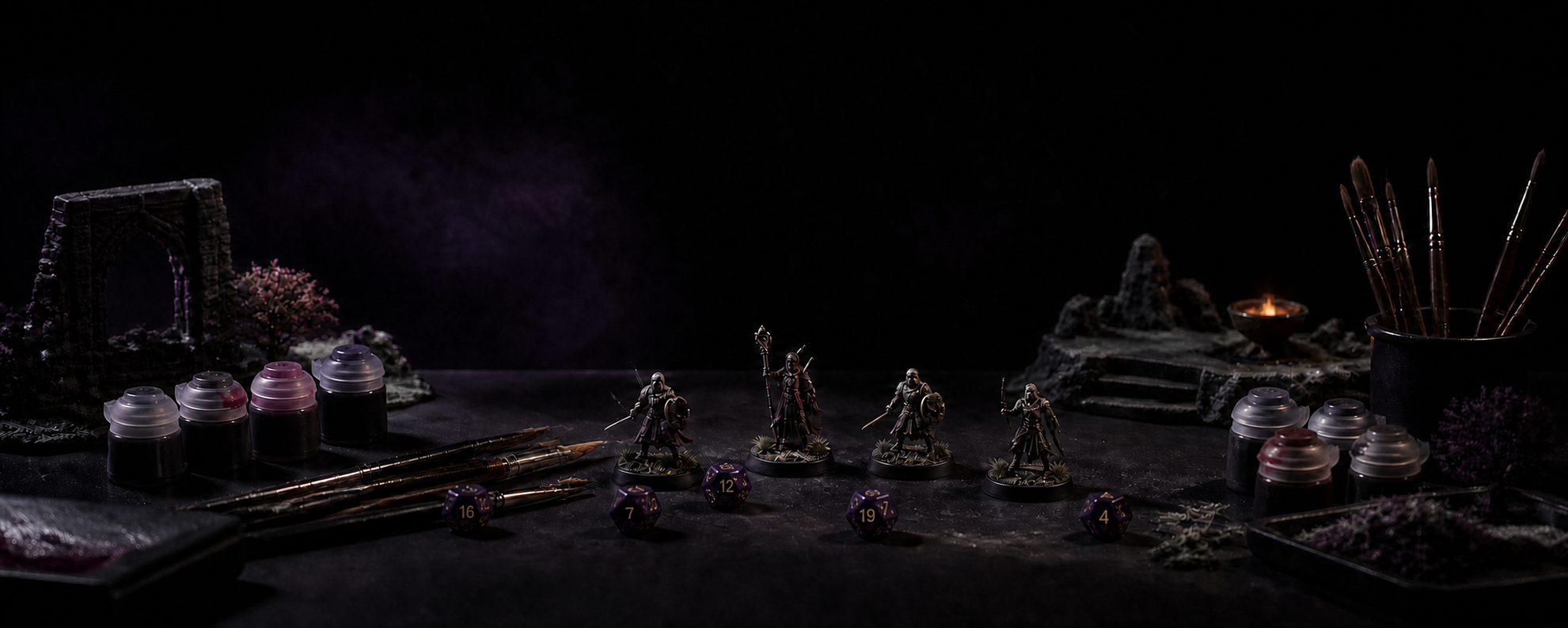 A tabletop hobby workbench with miniatures, numbered dice, paint pots and brushes